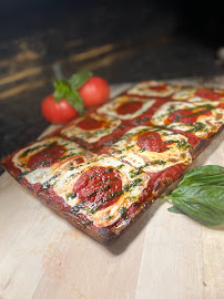 A pizza sitting on top of a wooden cutting board.